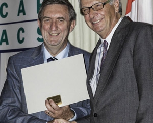 CAHS President Thomas Marrie presents Reinhart Reithmeier with certificate of membership as a Fellow of the Canadian Academy of Health Sciences (CAHS)